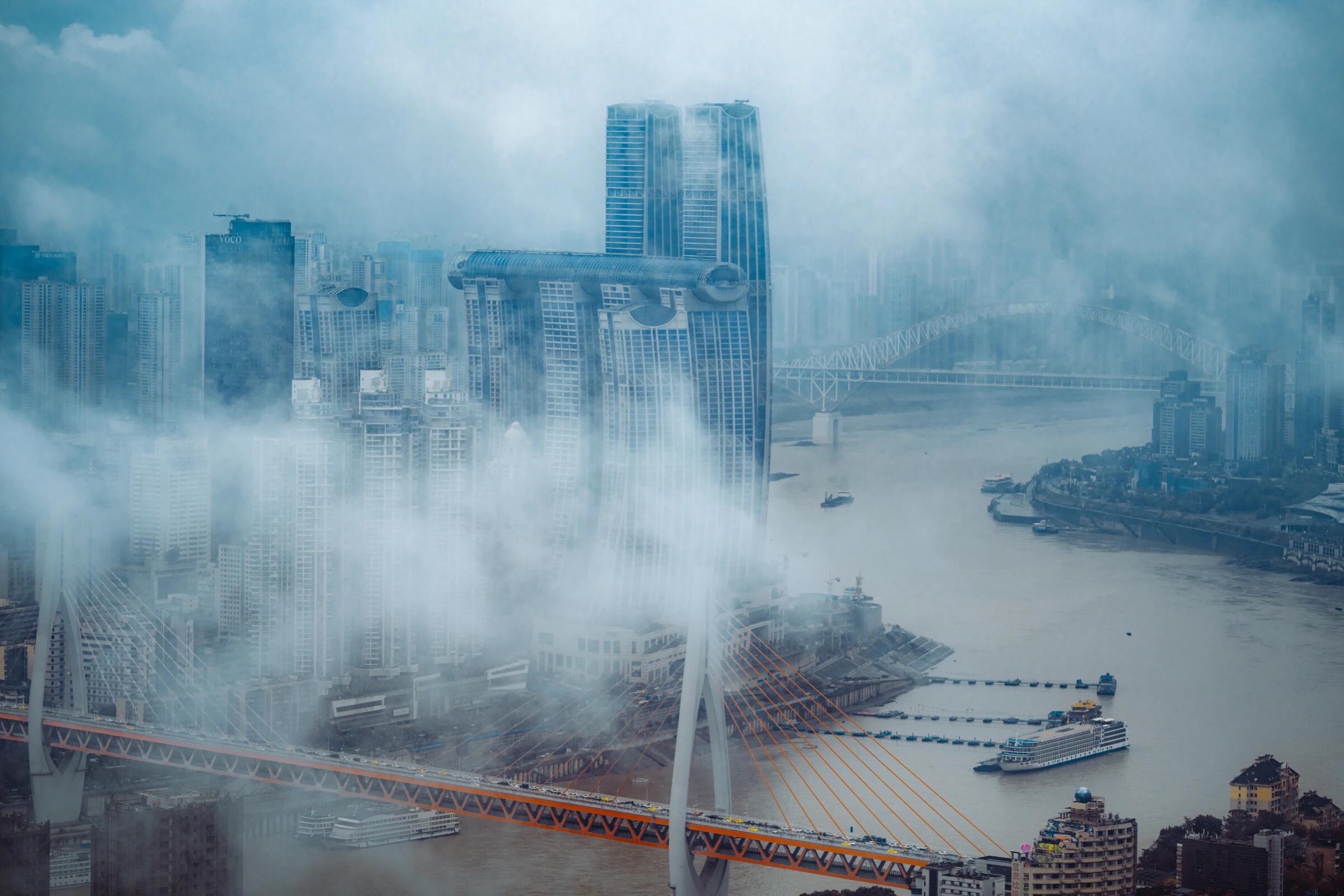 Chongqing’s layered rail, river, bridges, and vertical skyline